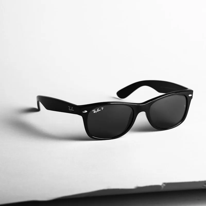 Sunglasses on yellow background - commercial photo