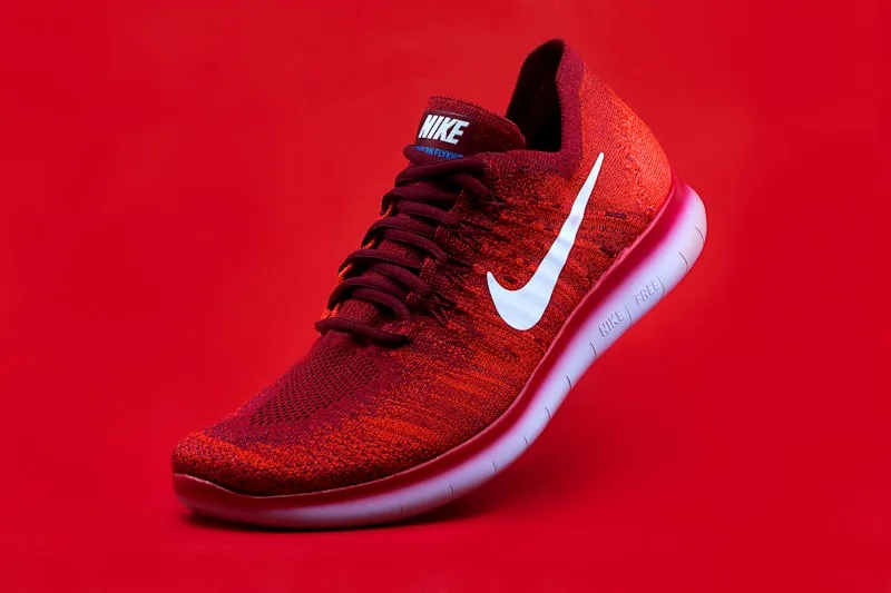 Red sneakers product photography on background
